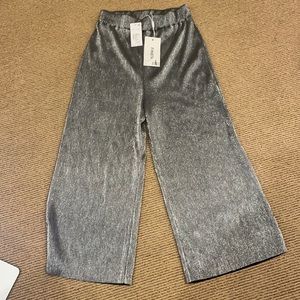 Likely wide legged cropped pants